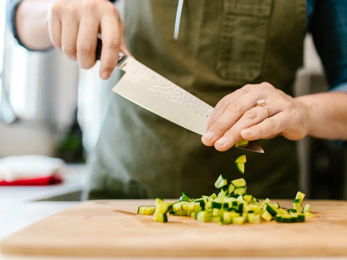 An oiled preparation board with chopped vegetables